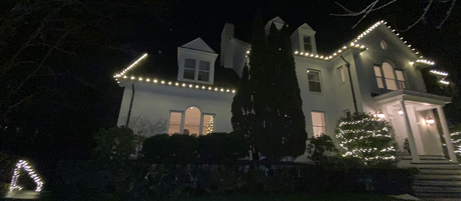 Festive Middletown home at night